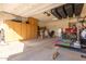 Garage with storage cabinets and exercise equipment at 27227 N 171St Dr, Surprise, AZ 85387