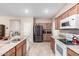 Modern kitchen with stainless steel appliances and granite countertops at 27227 N 171St Dr, Surprise, AZ 85387