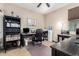 Home office featuring a desk, chair, and shelving at 27227 N 171St Dr, Surprise, AZ 85387