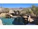 Beautiful pool with a waterfall feature and mountain views at 4361 S Tigre Del Mar Dr, Gold Canyon, AZ 85118