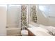 Bright bathroom features a shower-tub combo and vanity with storage at 4709 W Westcott Dr, Glendale, AZ 85308