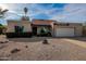 Charming single-story home featuring a two-car garage and low maintenance desert landscaping at 4709 W Westcott Dr, Glendale, AZ 85308