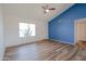 Bright living room offering new floors, a large window and an accent wall at 4709 W Westcott Dr, Glendale, AZ 85308