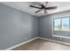 Gray-walled bedroom with wood-look floors and a ceiling fan at 609 W Grandview Rd, Phoenix, AZ 85023