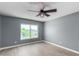 Bedroom with gray walls, wood floors, and a ceiling fan at 609 W Grandview Rd, Phoenix, AZ 85023