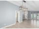 Dining room with gray walls, wood floors, and a view of the kitchen at 609 W Grandview Rd, Phoenix, AZ 85023