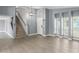 Bright dining room with gray walls, wood floors, and a view of the front door at 609 W Grandview Rd, Phoenix, AZ 85023