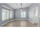 Dining area with gray walls, wood floors, and a view of the pool at 609 W Grandview Rd, Phoenix, AZ 85023