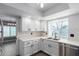 Modern kitchen with white cabinets and stainless steel appliances at 609 W Grandview Rd, Phoenix, AZ 85023