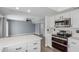 Modern kitchen featuring stainless steel appliances and white shaker cabinets at 609 W Grandview Rd, Phoenix, AZ 85023