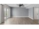 Spacious living room featuring hardwood floors and a ceiling fan at 609 W Grandview Rd, Phoenix, AZ 85023