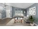 Living room with gray walls, wood floors, and modern furniture at 609 W Grandview Rd, Phoenix, AZ 85023