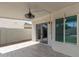 Covered patio with tile flooring, ceiling fan, and French doors at 609 W Grandview Rd, Phoenix, AZ 85023