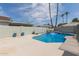 Refreshing blue pool with waterfall and spacious deck at 609 W Grandview Rd, Phoenix, AZ 85023