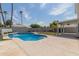 Sparkling pool with waterfall feature, surrounded by a patio at 609 W Grandview Rd, Phoenix, AZ 85023