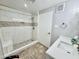 Bathroom with walk-in shower featuring bench, and white sink and cabinets at 6125 E Indian School Rd # 167, Scottsdale, AZ 85251