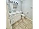 Bathroom featuring white cabinets, modern mirror, and updated fixtures at 6125 E Indian School Rd # 167, Scottsdale, AZ 85251