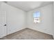 Spacious bedroom with plush carpeting and large window at 7423 W Cavalier Dr, Glendale, AZ 85303