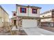 Two-story home with stone accents and red shutters at 7423 W Cavalier Dr, Glendale, AZ 85303