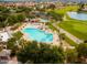 Community pool and surrounding landscape with golf course view at 9542 E Sunridge Dr, Sun Lakes, AZ 85248