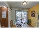 Bright breakfast nook with backyard view and casual dining table at 10113 W Kingswood Cir, Sun City, AZ 85351