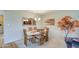 Elegant dining room, featuring a marble table and six chairs at 10113 W Kingswood Cir, Sun City, AZ 85351