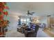 Relaxing living room with comfortable seating and sliding glass doors at 10113 W Kingswood Cir, Sun City, AZ 85351