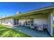 Covered patio with seating for outdoor dining at 10113 W Kingswood Cir, Sun City, AZ 85351