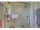 Shower stall with glass enclosure and tiled walls at 10113 W Kingswood Cir, Sun City, AZ 85351