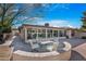 Relaxing backyard patio with seating area and gravel landscaping at 10442 E Flintlock Dr, Sun Lakes, AZ 85248