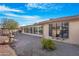 Landscaped backyard with a fountain and gravel landscaping at 10442 E Flintlock Dr, Sun Lakes, AZ 85248