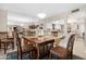 Bright dining area with wood table and chairs, view of kitchen at 10442 E Flintlock Dr, Sun Lakes, AZ 85248