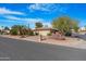 Single-story home with desert landscaping and a two-car garage at 10442 E Flintlock Dr, Sun Lakes, AZ 85248