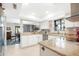 Modern kitchen with granite counters, white cabinets, and stainless steel appliances at 10442 E Flintlock Dr, Sun Lakes, AZ 85248