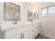 Double vanity bathroom with modern finishes and plenty of storage at 10831 W Laurie Ln, Peoria, AZ 85345