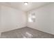 Simple bedroom with neutral walls and carpeted floors at 10831 W Laurie Ln, Peoria, AZ 85345