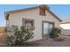 Side view of a single-story house with rock landscaping at 10831 W Laurie Ln, Peoria, AZ 85345