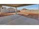 Spacious covered back patio area offering beautiful views of the surrounding landscape at 14778 W Tether Trl, Surprise, AZ 85387