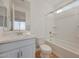 Well-appointed bathroom featuring dual sinks, modern fixtures, and a bathtub with shower combination at 14778 W Tether Trl, Surprise, AZ 85387