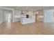 Well-lit kitchen with white cabinets, subway tile backsplash, and a center island at 14778 W Tether Trl, Surprise, AZ 85387