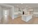 Spacious kitchen featuring white cabinetry, a large island, and stainless steel appliances at 14778 W Tether Trl, Surprise, AZ 85387