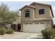 Two story house with beige exterior and attached garage at 16621 S 44Th Pl, Phoenix, AZ 85048