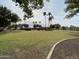 Community park with grassy area and palm trees at 16621 S 44Th Pl, Phoenix, AZ 85048