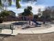 Community playground with playset and bench at 16621 S 44Th Pl, Phoenix, AZ 85048