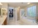 Elegant bathroom with walk-in shower and soaking tub at 17409 N Horseshoe Dr, Surprise, AZ 85374