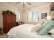 Well-lit bedroom with wood dresser and window seat at 17409 N Horseshoe Dr, Surprise, AZ 85374