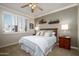 Cozy bedroom with window shutters and built-in shelves at 17409 N Horseshoe Dr, Surprise, AZ 85374