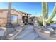 Landscaped front yard with cacti and stone pathway at 17409 N Horseshoe Dr, Surprise, AZ 85374