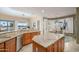 Open kitchen with granite counters and views to backyard at 17409 N Horseshoe Dr, Surprise, AZ 85374