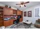 Home office with built-in wooden shelving and desk at 17409 N Horseshoe Dr, Surprise, AZ 85374